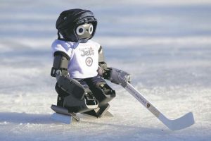 Robots Playing Ice Hockey in the ground.